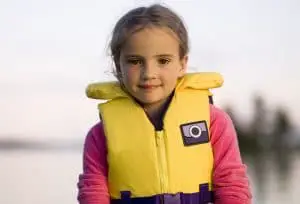 Little girl girl wearing a life jacket